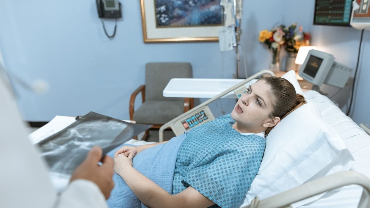 Patient resting in a hospital bed after surgery